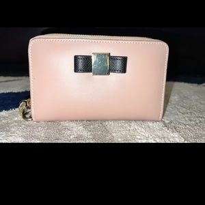 Ivanka Trump Wristlet,  mussing the black wristlet strap.